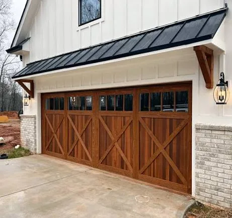 Stained wood carriage-style garage door with windows