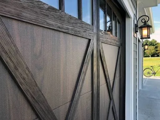 Weathered wood-look garage door with X-brace detailing